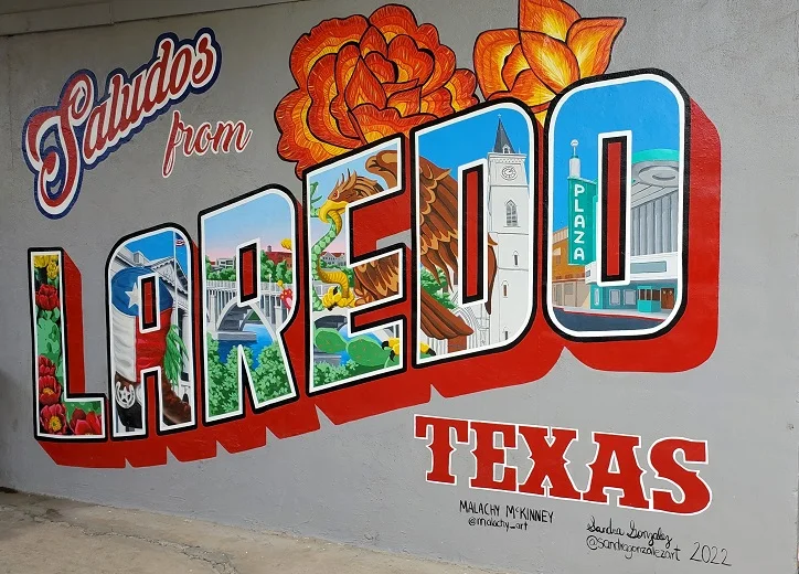 Colorful Saludos from Laredo, Texas mural featuring local landmarks and flowers